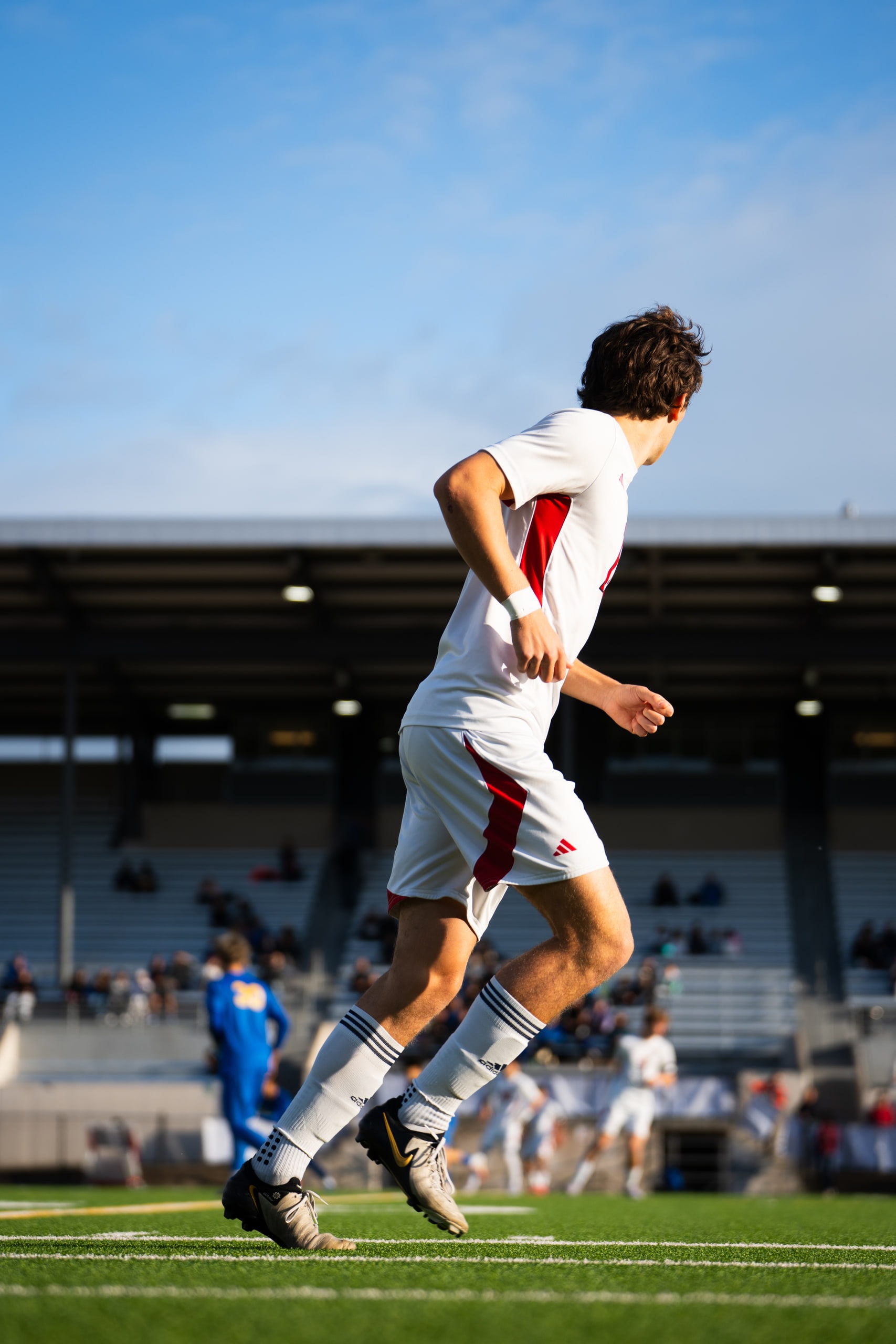 A player jumping to control a high ball