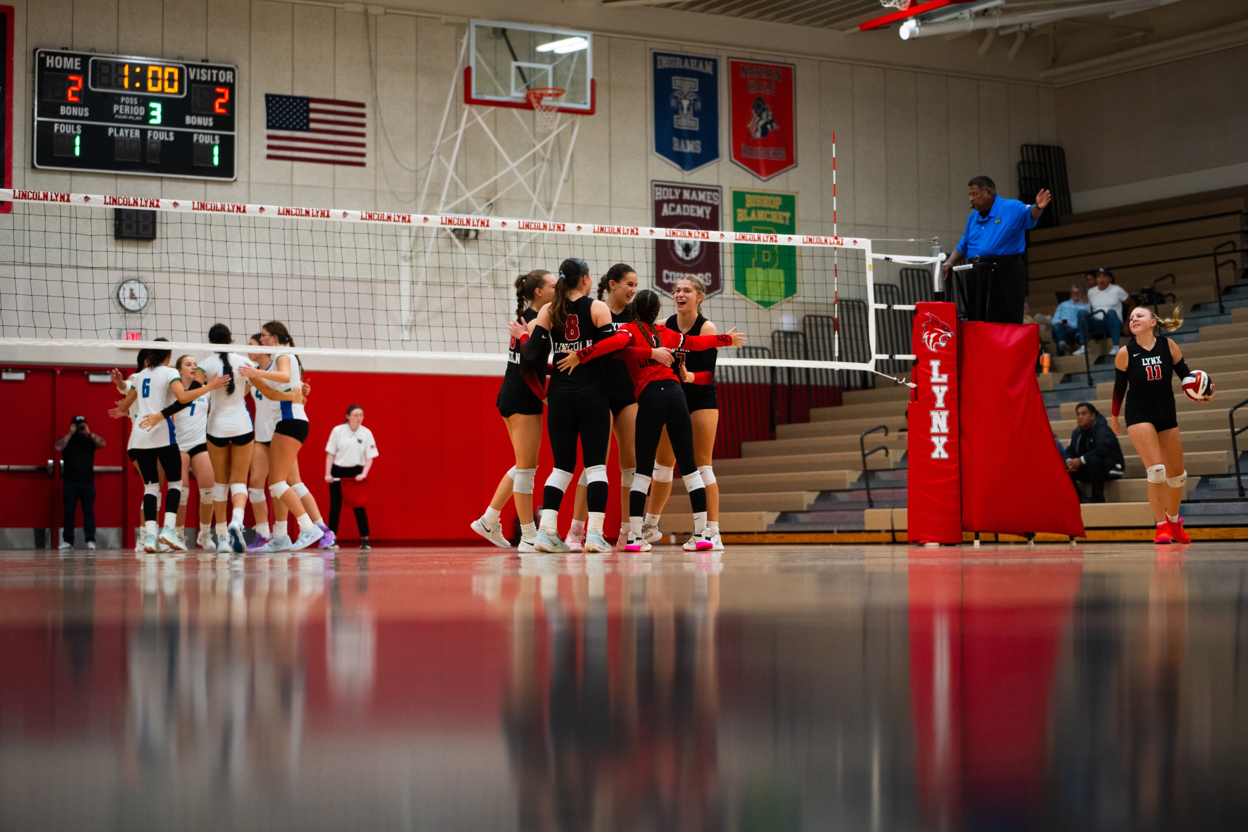 Teammates gathered in a huddle between points