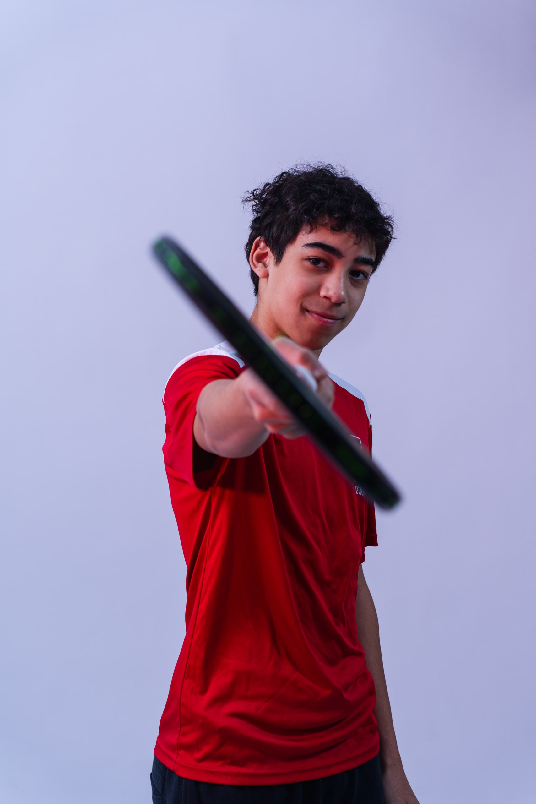 A player extending his racket toward the camera